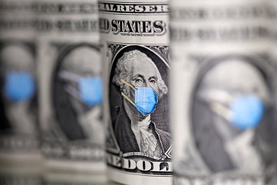 U.S. dollars are seen with facemasks during the coronavirus pandemic in this illustration photo. Dioceses are helping parishes tap revenue streams during the COVID-19 pandemic.